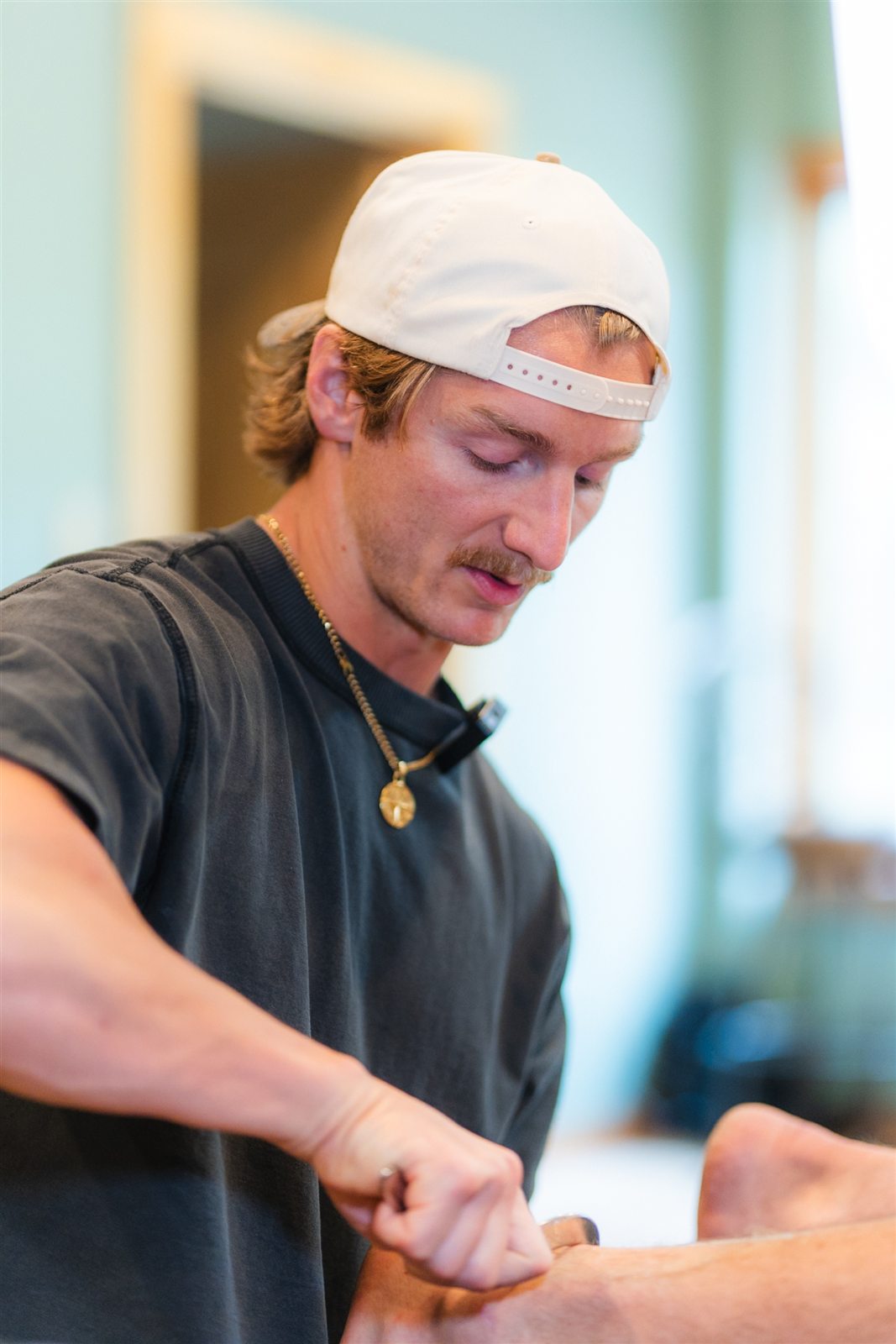 Hands-on soft-tissue treatment for an athlete