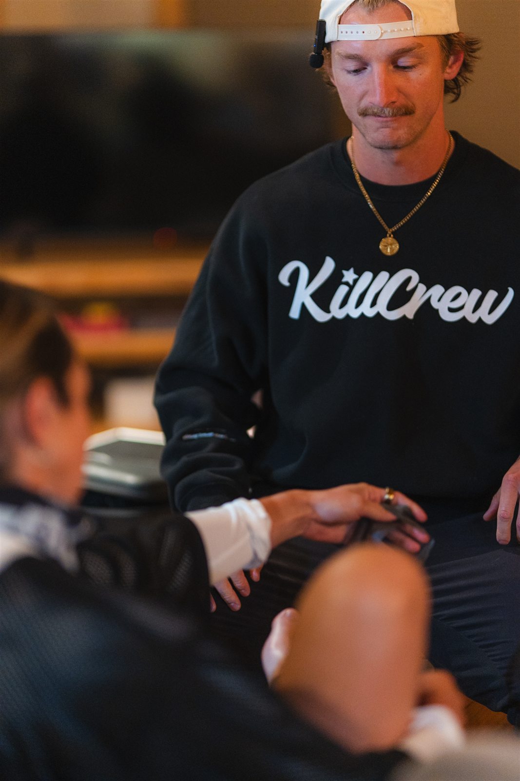 Dr. Bridger Cutler listening to a patient